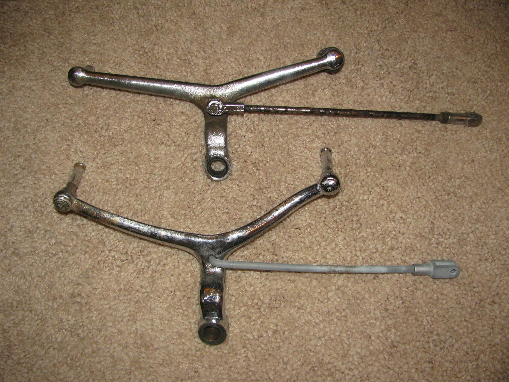 Inside view of both shift lever styles. Top shift lever is a later Tonti framed model. Bottom shift lever is from a loop frame.
