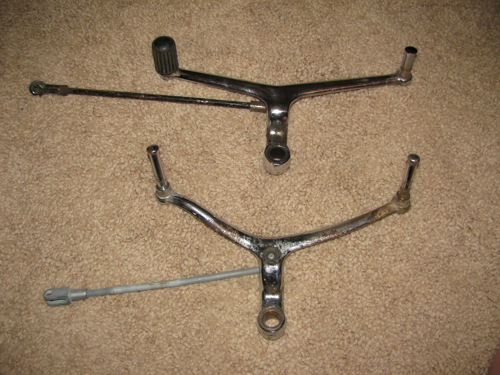 Outside view of both shift lever styles. Top shift lever is a later Tonti framed model. Bottom shift lever is from a loop frame.