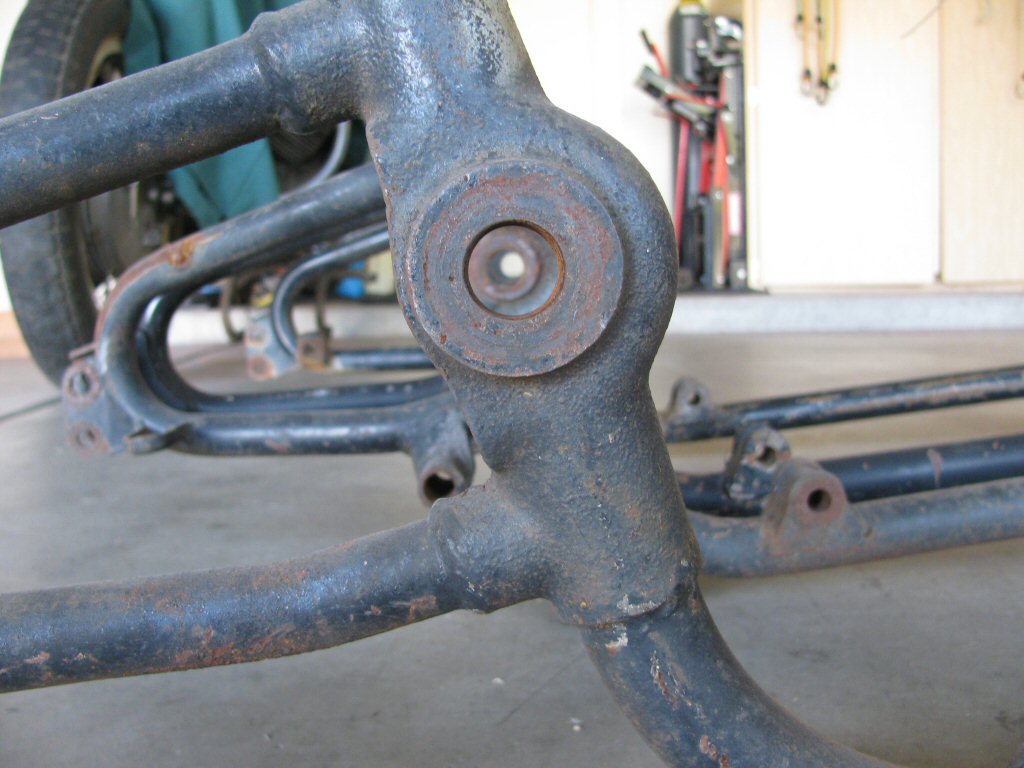 Alignment of the swing arm pivot holes.