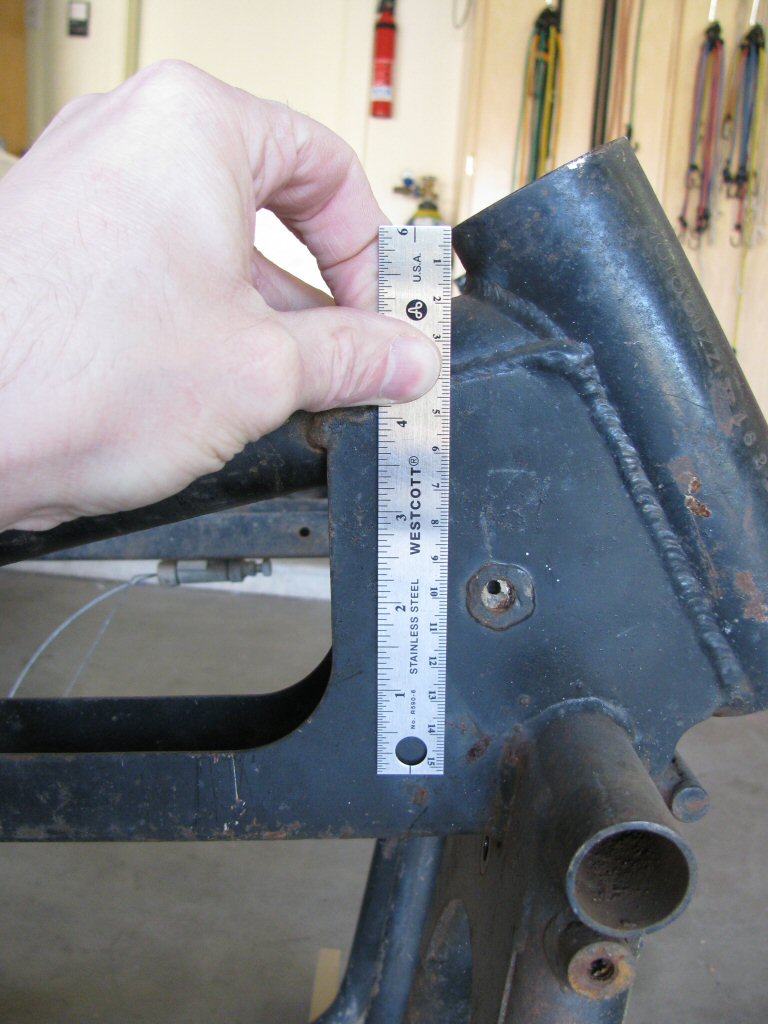 Early frame measures 100 mm down from the trailing edge of the top of the steering neck.