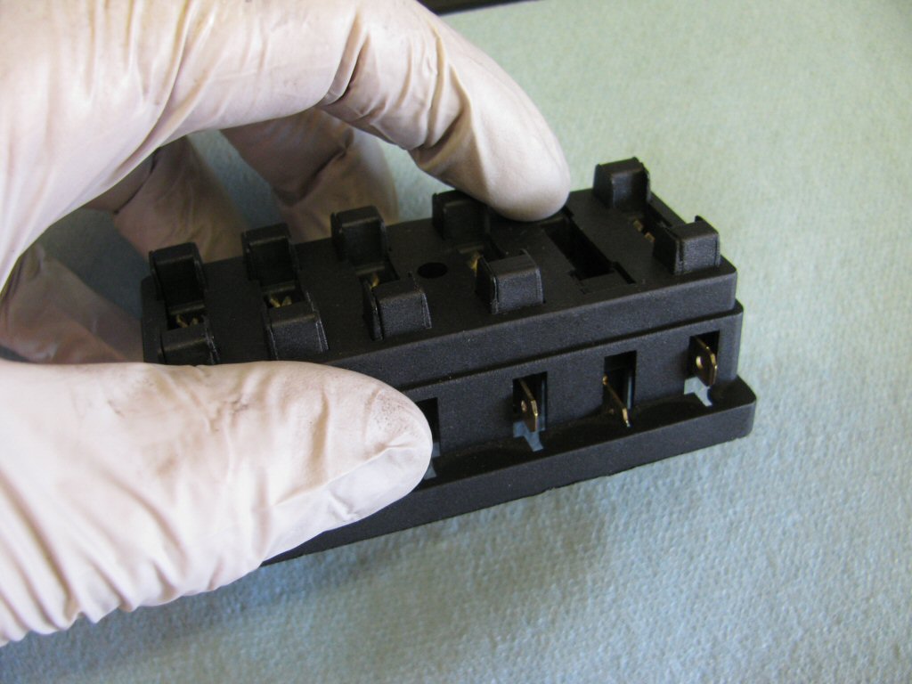 Each fuse holder is easily removed by pushing down from the top of the fuse box until the fuse holder is level with the top.