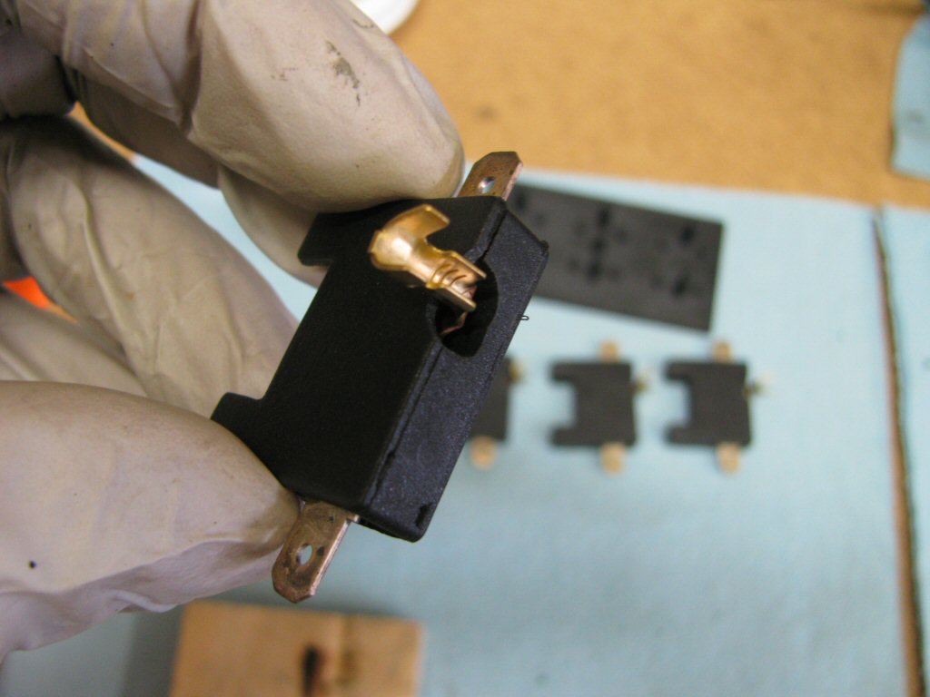 A close up view of the modified fuse holder and cover.