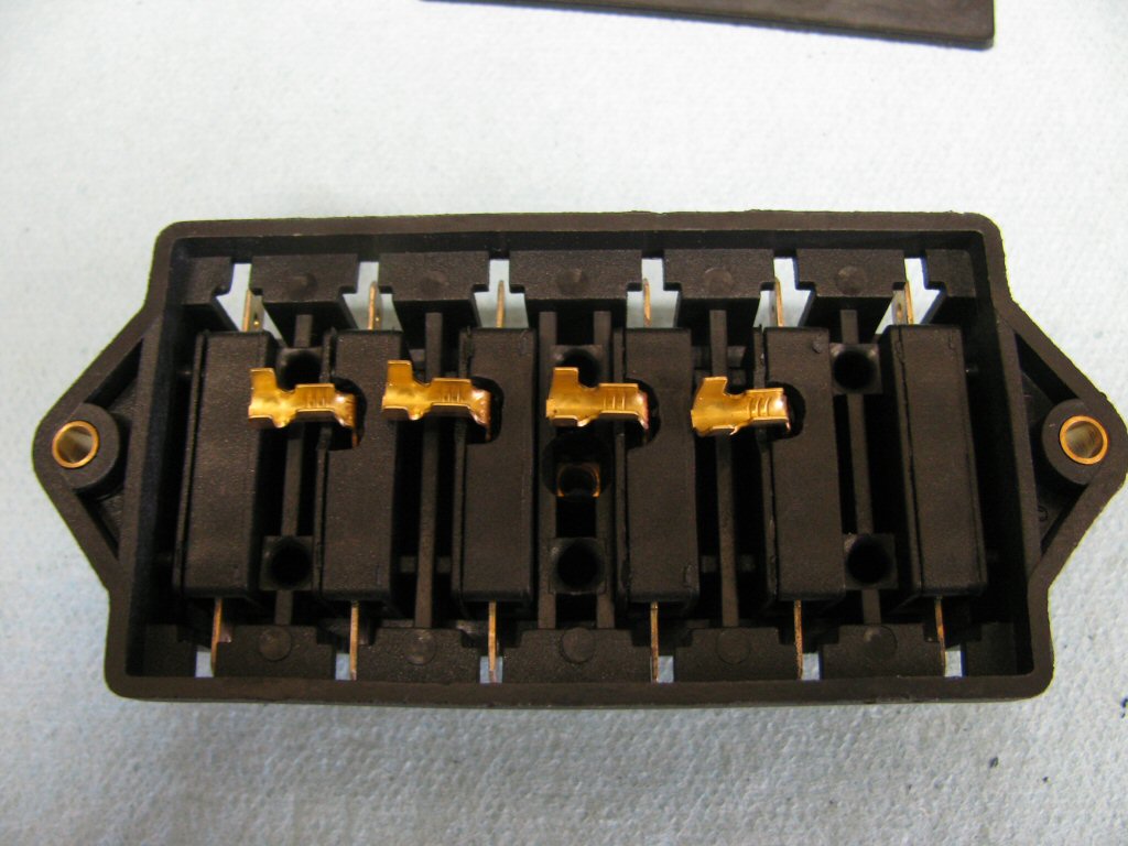 I set the individual fuse holders back in to the main case. The strain relief tabs on the terminal are too long.
