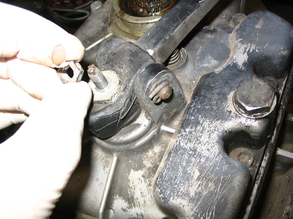 First, remove the smaller jam nut from the back of the transmission.
