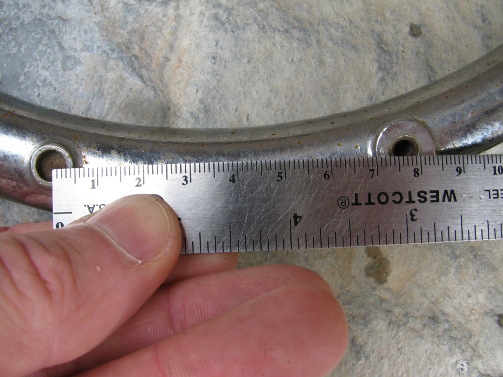 Left side crash bar; ~77 mm measurement.