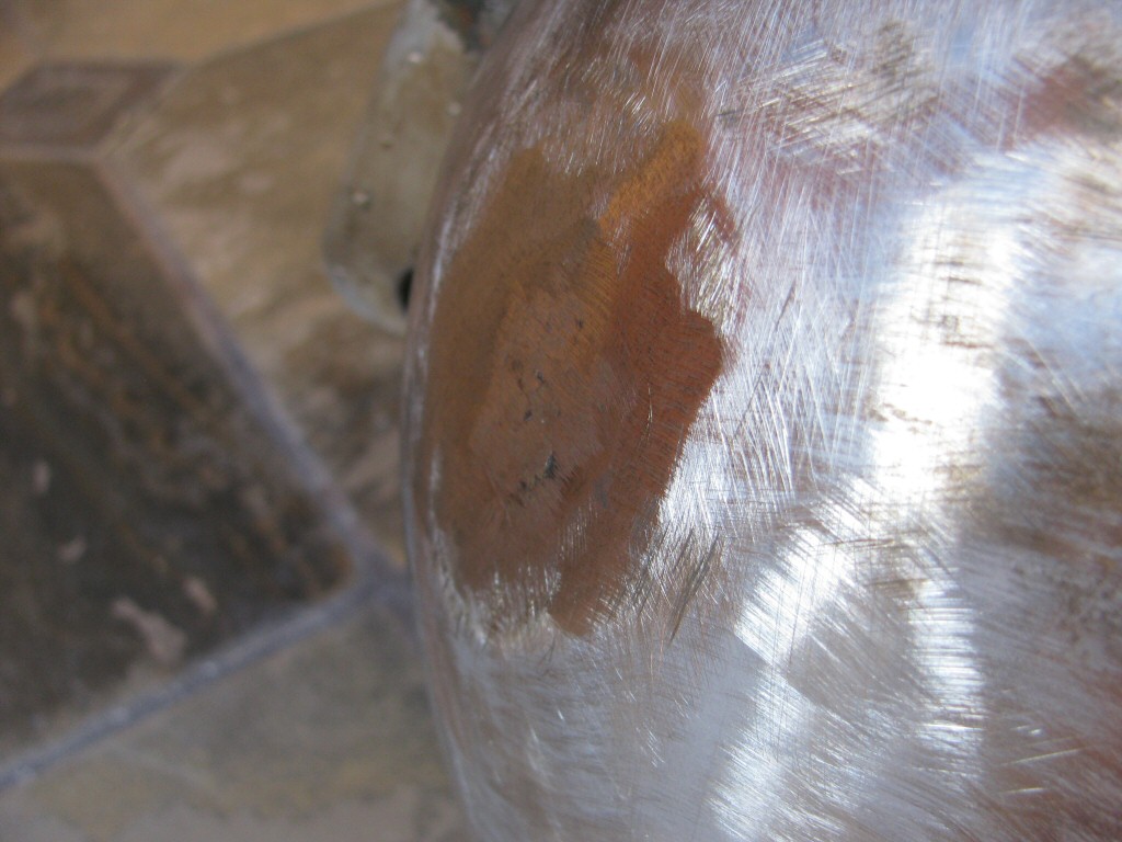 Dent pulled from left front of tank, ready for filler.