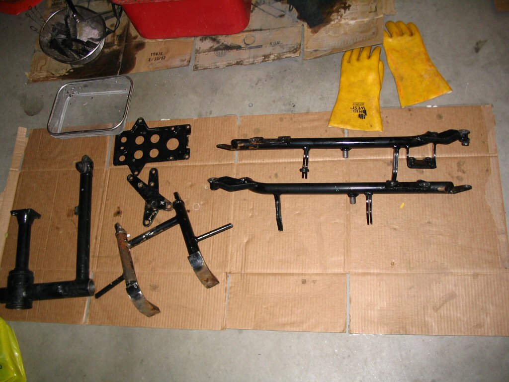 Striped frame components cleaned and awaiting blast and powder coat.