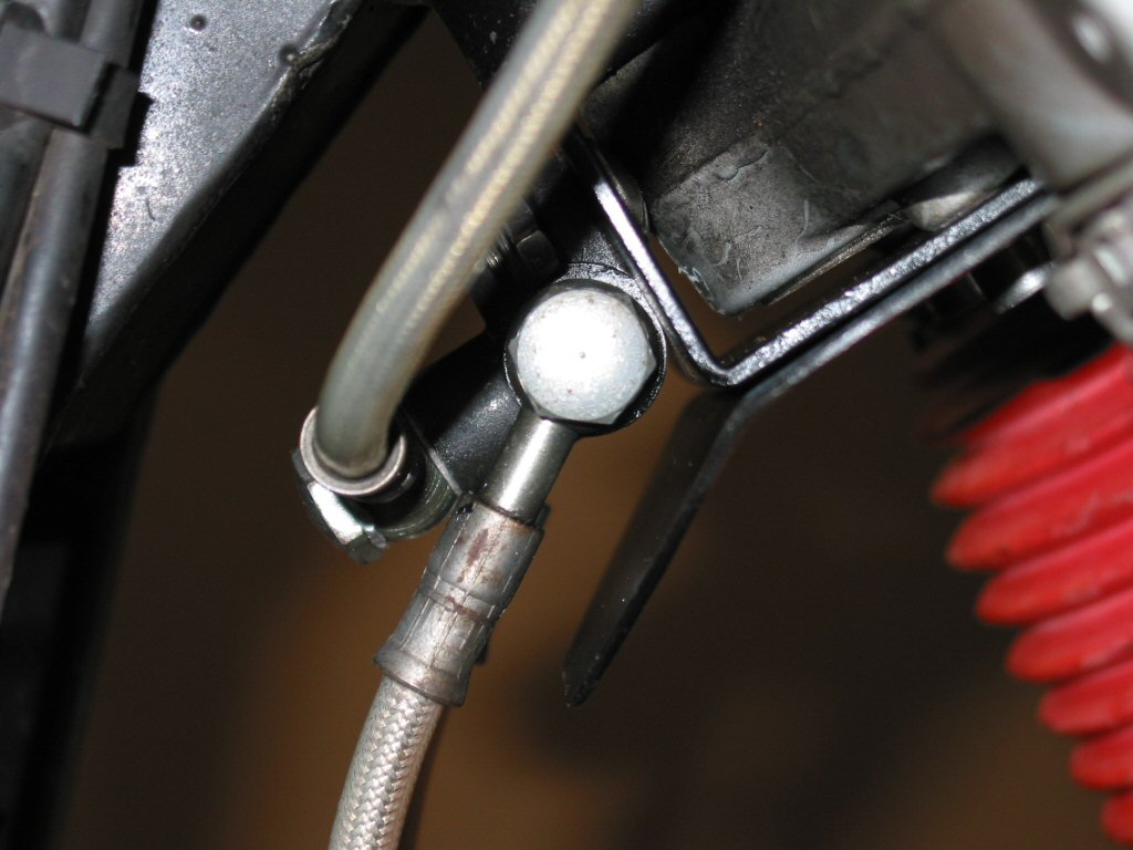 Protecting the brake lines on a Moto Guzzi Quota 1000.