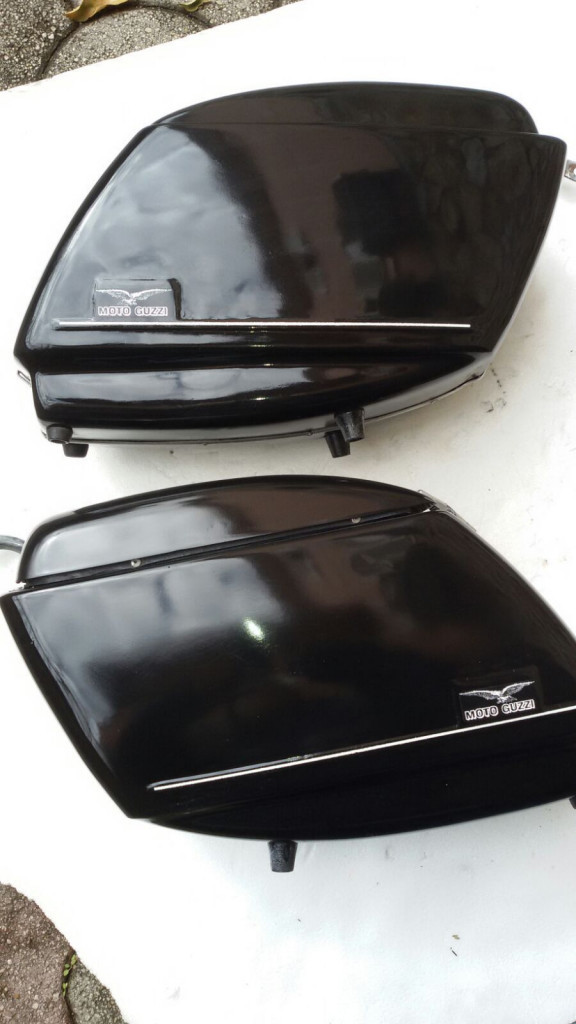 Original Moto Guzzi saddlebags that have had the handles removed from the lid (smaller).