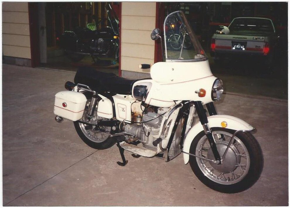 George Vignovich's A-series Moto Guzzi Ambassador with metal saddlebags.