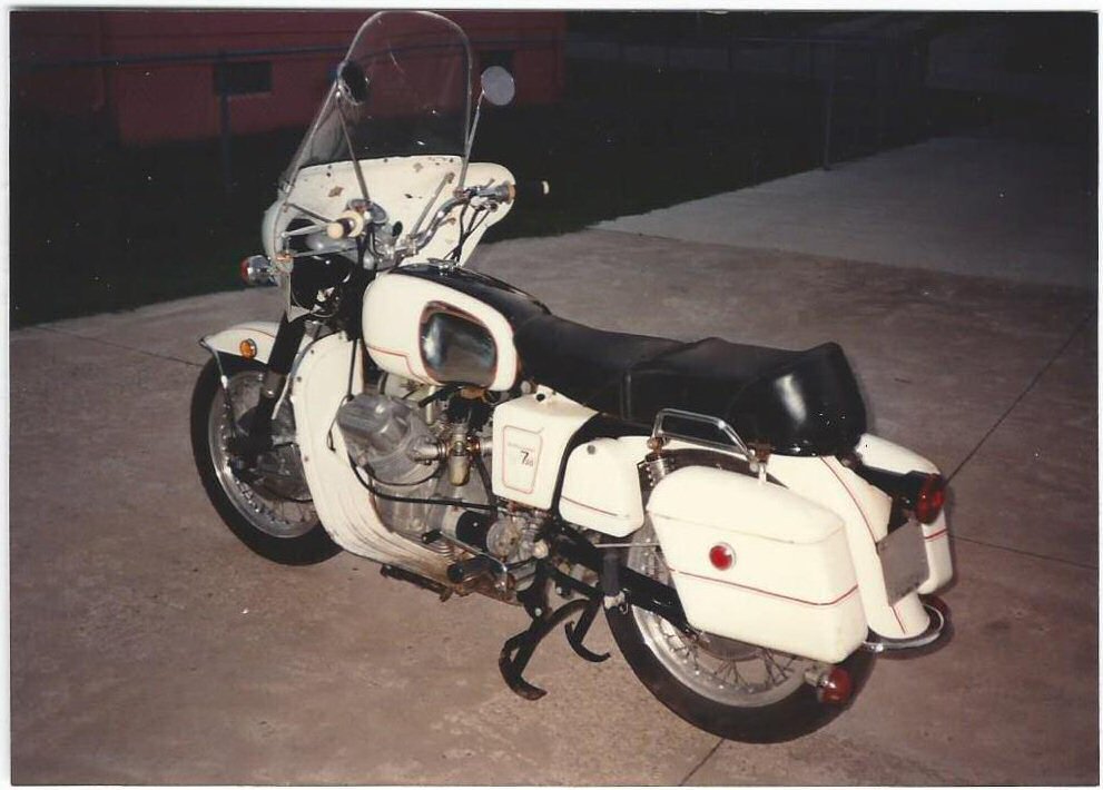 George Vignovich's A-series Moto Guzzi Ambassador with metal saddlebags.