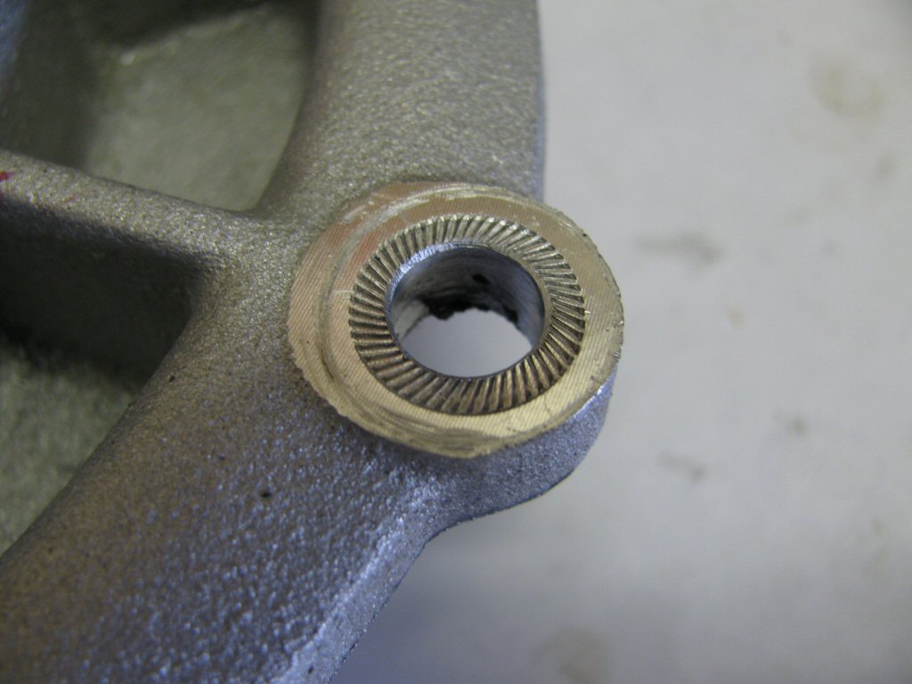 Schnorr washer embedded into the aluminum material of the rear main bearing flange on my 1971 Moto Guzzi Ambassador.