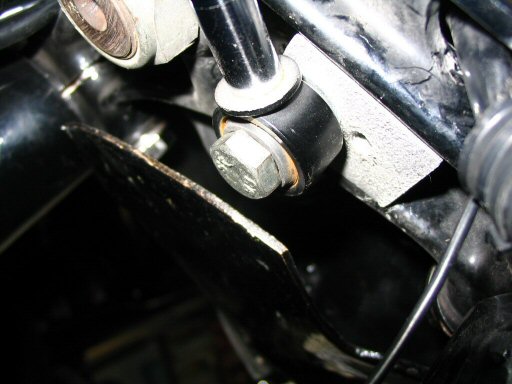 This is how I secured the steering damper to the aluminum spacer block. Not stock...but works great.