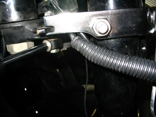 A good look at how I relieved a portion of the right turn signal bracket to clear the body of the steering damper.
