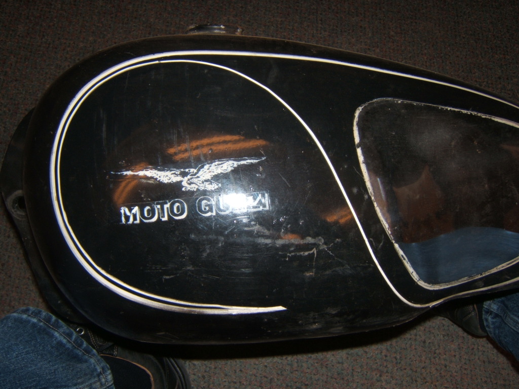 Original pin striping on the fuel tank: side view and chrome panel.