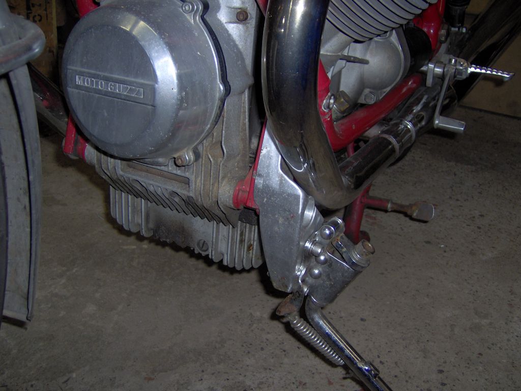 Side stand bracket enabling the fitment of a long side stand on a Moto Guzzi 850 T.
