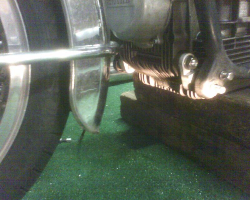 Hanger bracket, fender, alternator cover: A shot of the tonti motor to loop frame hanger brackets, and the needed fender bracket re-route.