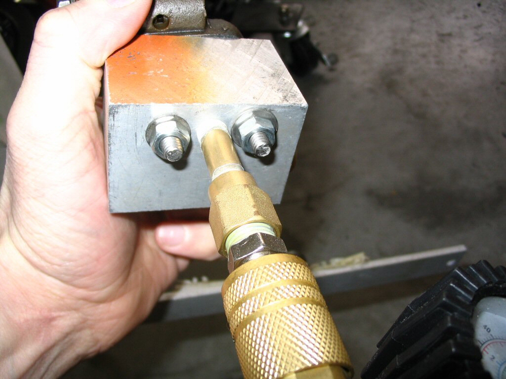 Pressure tester for an oil pressure relief valve.