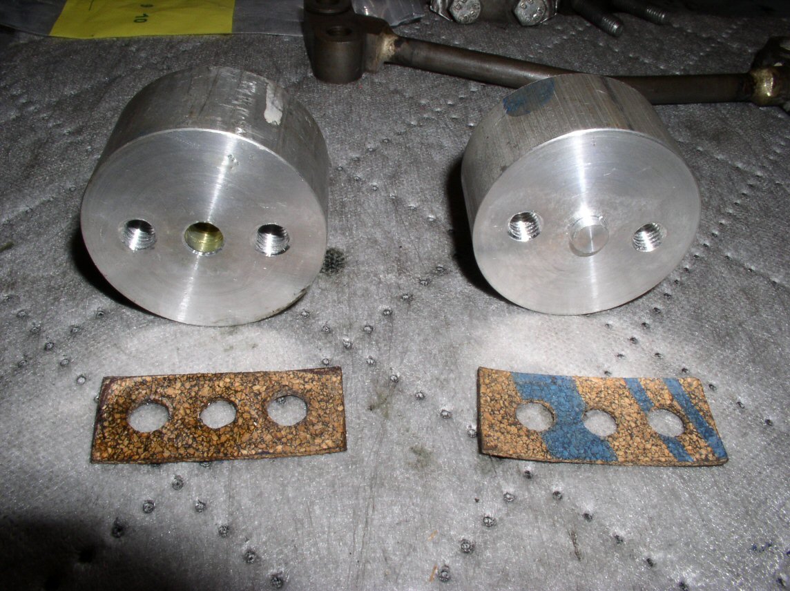 Pucks and gaskets. Block-off has a nub that protrudes into the oil pipe. It's mostly to make drilling the holes accurately easier.