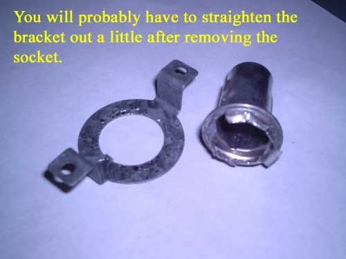 You will probably have to straighten the bracket out a little after removing the socket.
