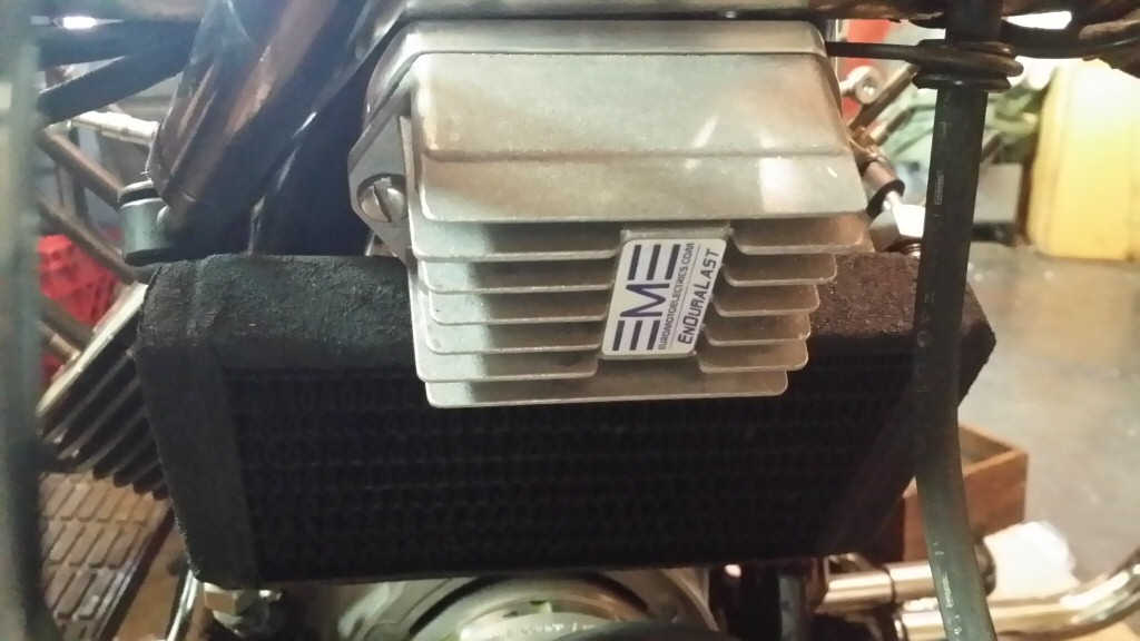Voltage regulator/rectifier in place above original oil cooler on a Moto Guzzi V1000 I-Convert.
