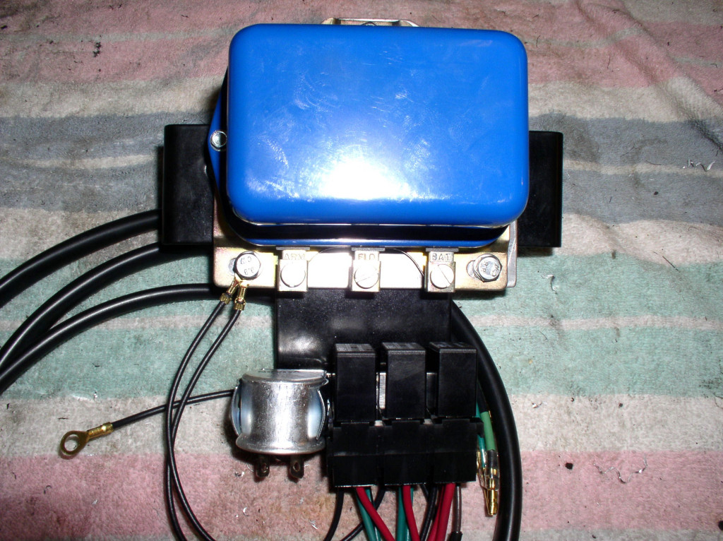 Voltage regulator mounted to the plate