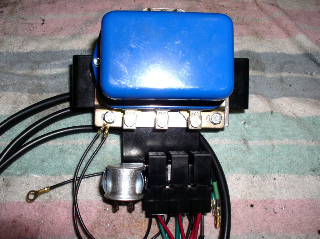 Voltage regulator mounted to the plate