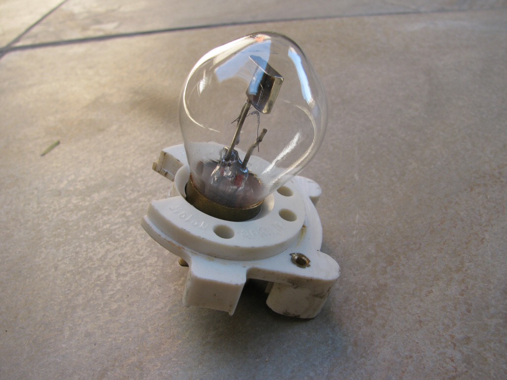 Headlight socket and bulb as fit to a Moto Guzzi Astore.