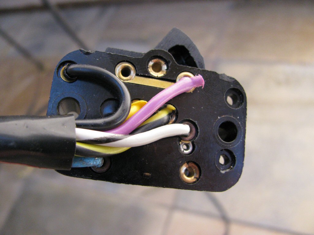 Close up view of wire connections on the bottom of the right handlebar switch.