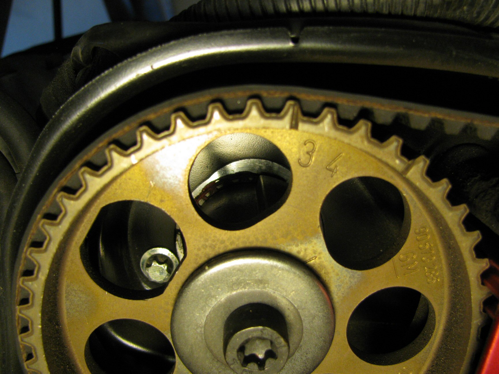 Camshaft pulley 3 aligned with notch in backing tin.