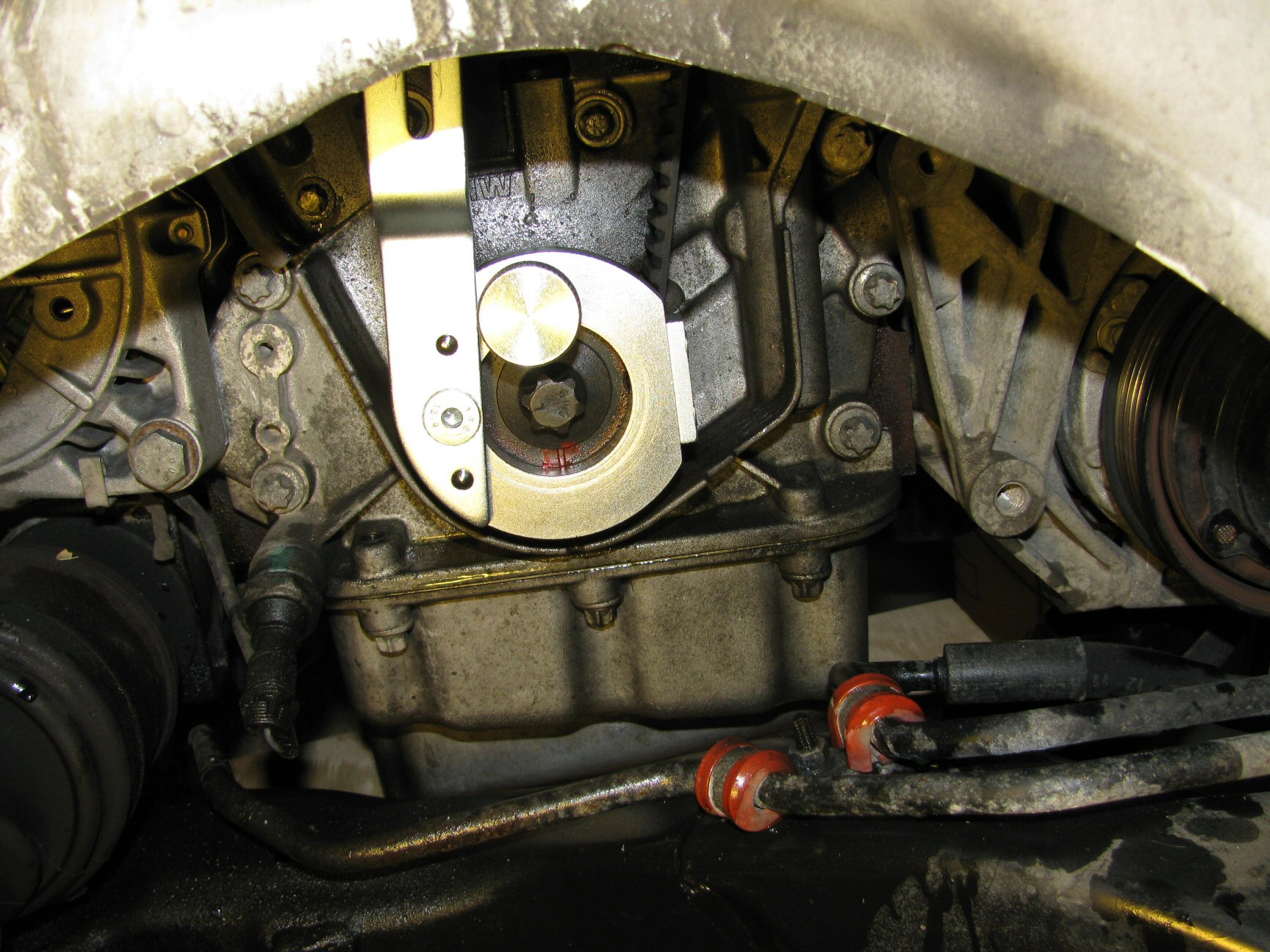 Notch on crankshaft pulley hub aligned with notch on engine block.
